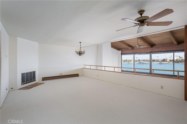 809 Via Lido Soud, Newport Beach, CA 92663 - unfurnished living room with a baseboard radiator, a water view, ceiling fan, carpet, and a wooden ceiling with exposed beams