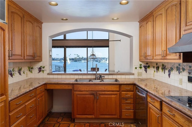 809 Via Lido Soud, Newport Beach, CA 92663 - kitchen featuring light stone countertops, tasteful backsplash, brown cabinets, and recessed lighting