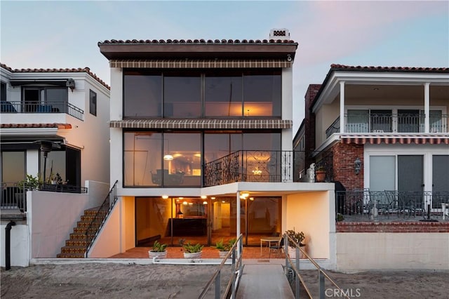 809 Via Lido Soud, Newport Beach, CA 92663 - back of property with stairway, stucco siding, and a tiled roof