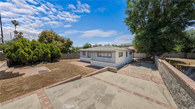 10816 Foothill Blvd, Sylmar, CA 91342 - view of front facade featuring a patio and a fenced backyard