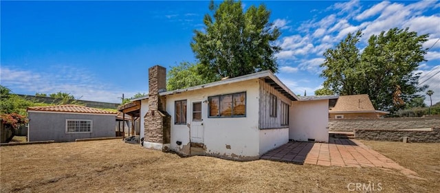 10816 Foothill Blvd, Sylmar, CA 91342 - view of front of house featuring a chimney, stucco siding, and a patio area