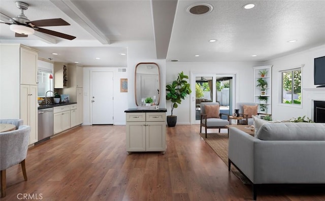 2119 E Denise Ave, Orange, CA 92867 - living room featuring recessed lighting, a textured ceiling, wood finished floors, a ceiling fan, and a fireplace