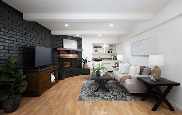 2119 E Denise Ave, Orange, CA 92867 - living room with a fireplace, light wood-style floors, beamed ceiling, and recessed lighting