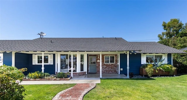 2119 E Denise Ave, Orange, CA 92867 - view of front of house featuring a front yard, roof with shingles, and brick siding