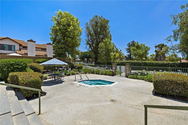 990 La Paz Rd Unit 49, Placentia, CA 92870 - view of pool featuring a community hot tub and a patio