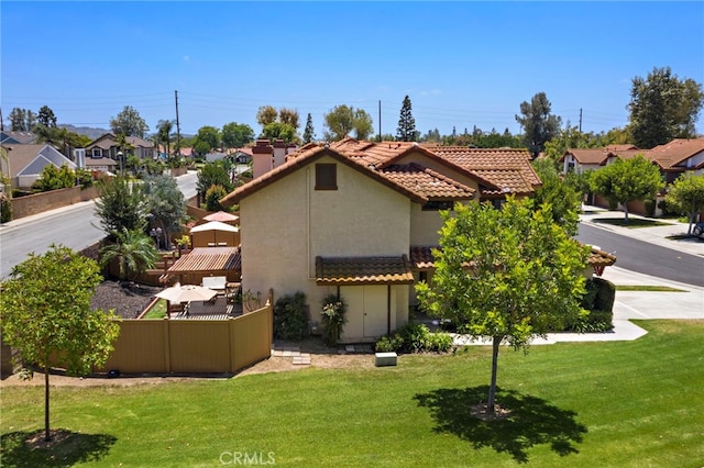990 La Paz Rd Unit 49, Placentia, CA 92870 - back of property featuring a tile roof, stucco siding, and a residential view