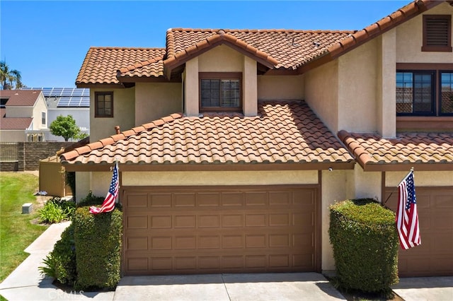 990 La Paz Rd Unit 49, Placentia, CA 92870 - mediterranean / spanish-style home featuring a tile roof, driveway, and stucco siding