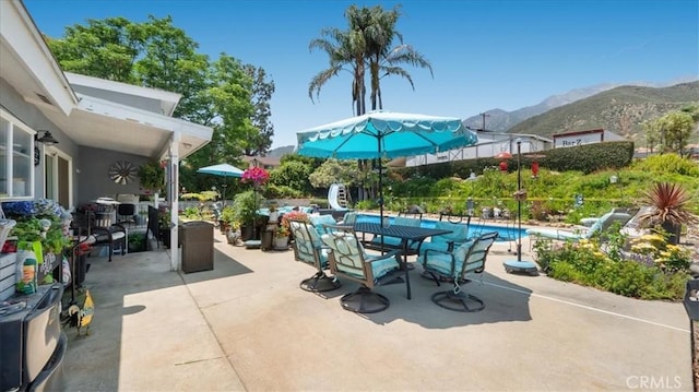 8356 Bella Vista Dr, Rancho Cucamonga, CA 91701 - view of patio featuring a mountain view and an outdoor pool