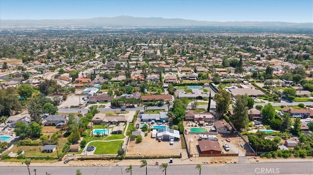 8356 Bella Vista Dr, Rancho Cucamonga, CA 91701 - aerial view of property's location with a mountain backdrop and nearby suburban area