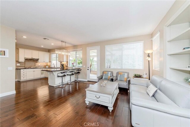 6242 E Inverness Pl, Orange, CA 92869 - living area with dark wood-type flooring and recessed lighting