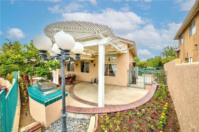 6242 E Inverness Pl, Orange, CA 92869 - view of patio featuring a ceiling fan, a pergola, and a gate