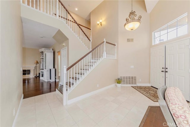 6242 E Inverness Pl, Orange, CA 92869 - foyer entrance featuring a high ceiling, tile patterned floors, and stairs
