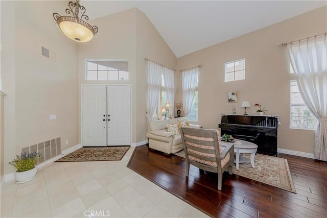 6242 E Inverness Pl, Orange, CA 92869 - foyer with high vaulted ceiling and wood-type flooring