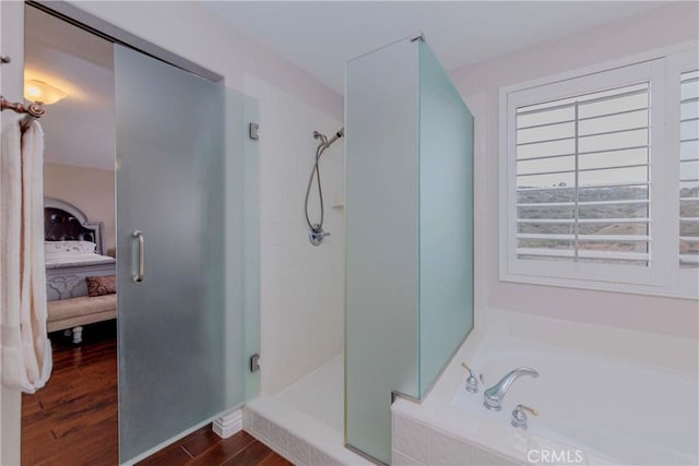 6242 E Inverness Pl, Orange, CA 92869 - bathroom with ensuite bath, a shower stall, a garden tub, and wood finished floors