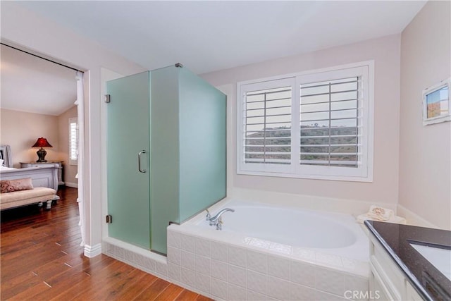 6242 E Inverness Pl, Orange, CA 92869 - bathroom with a garden tub, wood finished floors, a shower stall, vanity, and connected bathroom