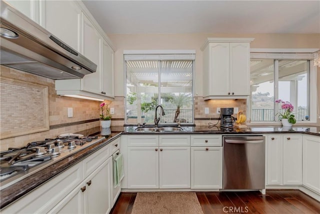 6242 E Inverness Pl, Orange, CA 92869 - kitchen featuring dishwasher, ventilation hood, gas stovetop, tasteful backsplash, and dark wood-type flooring