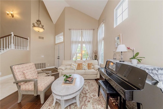 6242 E Inverness Pl, Orange, CA 92869 - living area featuring high vaulted ceiling and wood finished floors