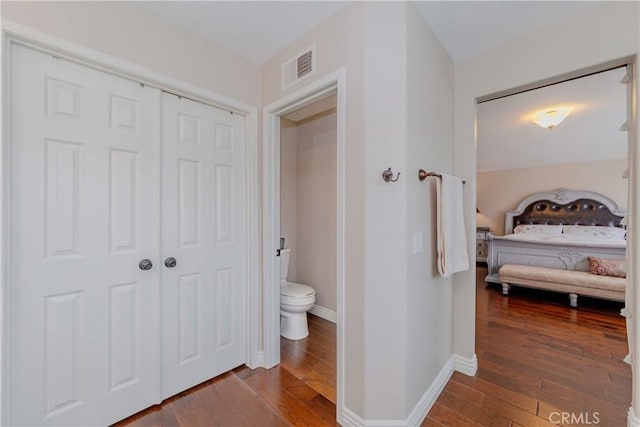 6242 E Inverness Pl, Orange, CA 92869 - bathroom featuring hardwood / wood-style floors and ensuite bathroom