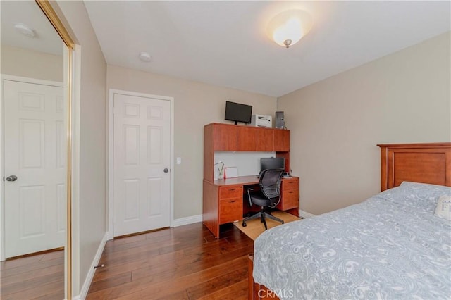 6242 E Inverness Pl, Orange, CA 92869 - bedroom with dark wood-style floors and an office area