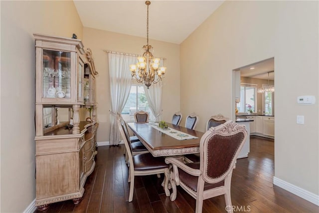 6242 E Inverness Pl, Orange, CA 92869 - dining room featuring a chandelier, lofted ceiling, and dark wood-style flooring