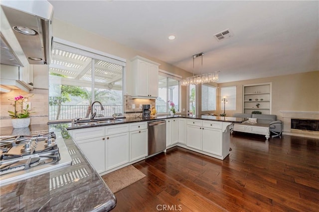6242 E Inverness Pl, Orange, CA 92869 - kitchen with stainless steel appliances, open floor plan, dark wood-style flooring, extractor fan, and backsplash
