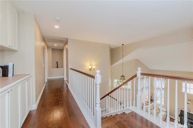 6242 E Inverness Pl, Orange, CA 92869 - corridor with an upstairs landing and dark wood-style flooring