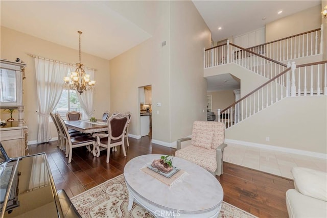 6242 E Inverness Pl, Orange, CA 92869 - living area with wood finished floors, a chandelier, stairway, and a high ceiling