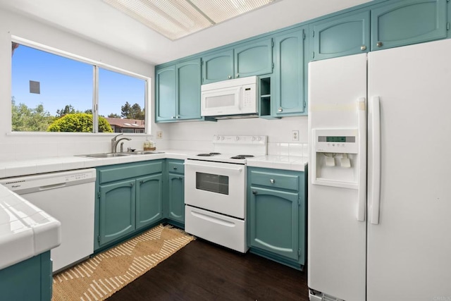 16566 Caminito Vecinos Unit 31, San Diego, CA 92128 - kitchen with white appliances, tile counters, and dark wood finished floors