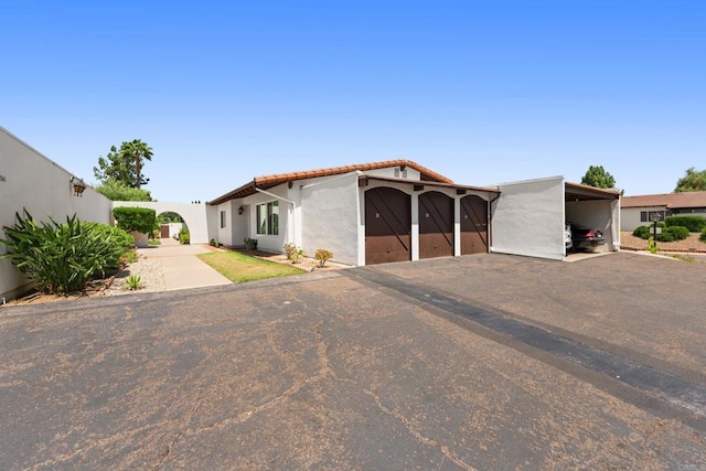 16566 Caminito Vecinos Unit 31, San Diego, CA 92128 - view of front facade with stucco siding and a tile roof