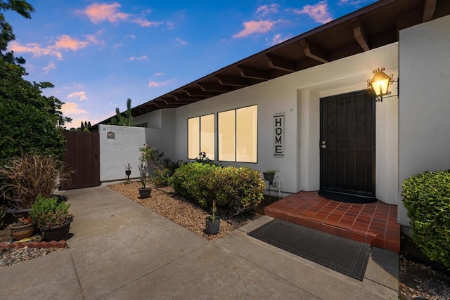 16566 Caminito Vecinos Unit 31, San Diego, CA 92128 - doorway to property with stucco siding and a gate
