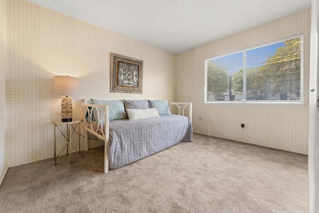 16566 Caminito Vecinos Unit 31, San Diego, CA 92128 - bedroom with wallpapered walls, carpet floors, and a textured ceiling