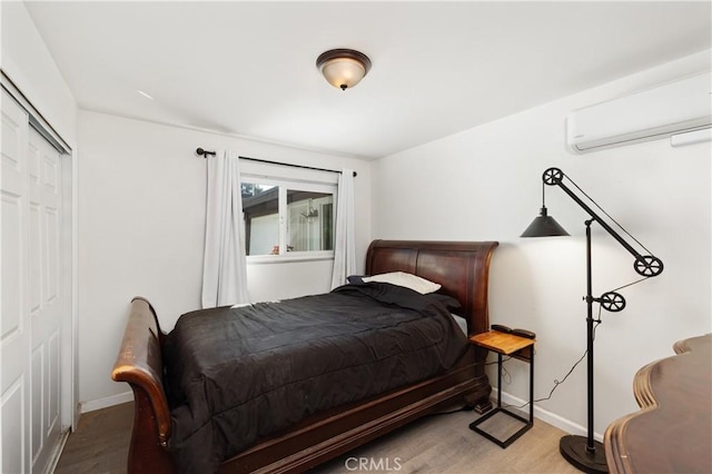 4657 Chateau Pl, San Diego, CA 92117 - bedroom featuring a wall unit AC, wood finished floors, and a closet
