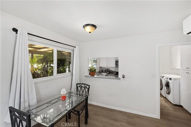 4657 Chateau Pl, San Diego, CA 92117 - dining room with washing machine and dryer, dark wood-style flooring, and a wall unit AC