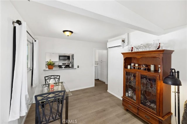 4657 Chateau Pl, San Diego, CA 92117 - corridor featuring a wall mounted AC and wood finished floors