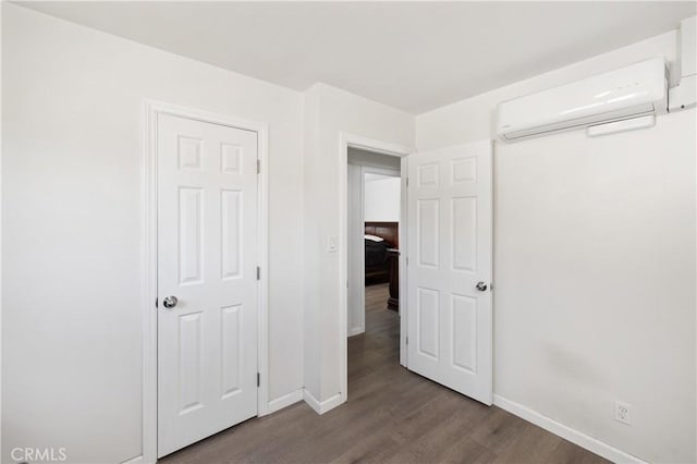 4657 Chateau Pl, San Diego, CA 92117 - unfurnished bedroom with a wall unit AC and wood finished floors