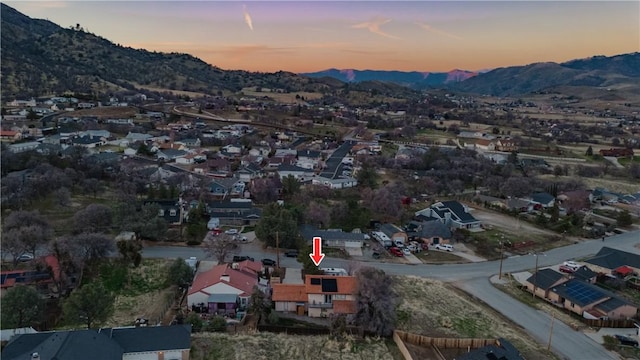 21304 Carriage Dr, Tehachapi, CA 93561 - aerial overview of property's location with a mountainous background and nearby suburban area