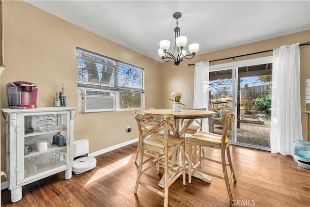 21304 Carriage Dr, Tehachapi, CA 93561 - dining area with a chandelier, wood finished floors, and cooling unit