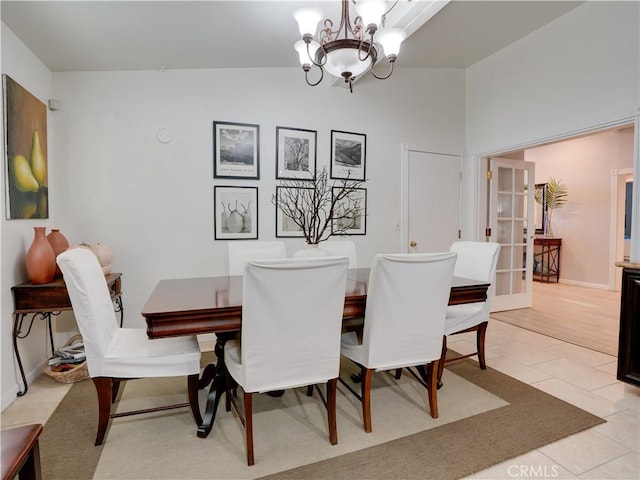 21829 Legend Ave, Carson, CA 90745 - dining area featuring a chandelier, lofted ceiling, and light tile patterned floors