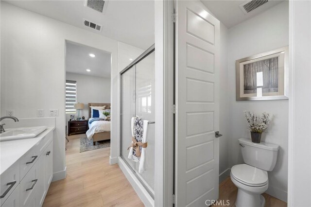 18309 Goldbark Way, Yorba Linda, CA 92886 - ensuite bathroom featuring a shower stall, double vanity, wood finished floors, and recessed lighting