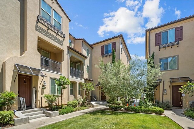 18309 Goldbark Way, Yorba Linda, CA 92886 - view of front facade with stucco siding and a front yard