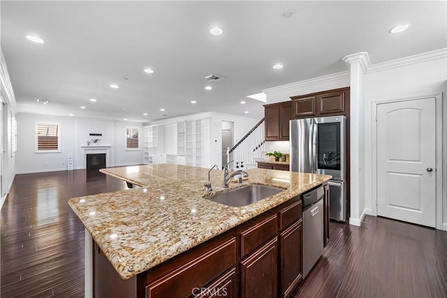 15448 Six M Ranch Ln, Fontana, CA 92336 - kitchen with appliances with stainless steel finishes, an island with sink, recessed lighting, open floor plan, and dark wood-style flooring