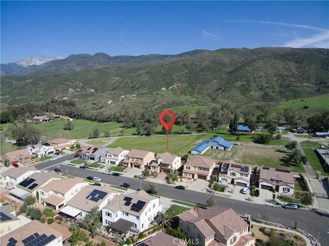 15448 Six M Ranch Ln, Fontana, CA 92336 - aerial view of property and surrounding area with a mountain backdrop and nearby suburban area