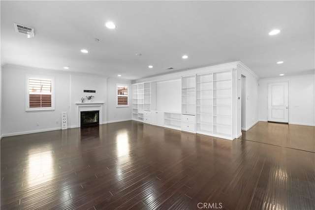 15448 Six M Ranch Ln, Fontana, CA 92336 - unfurnished living room featuring recessed lighting, wood finished floors, a fireplace, plenty of natural light, and built in features
