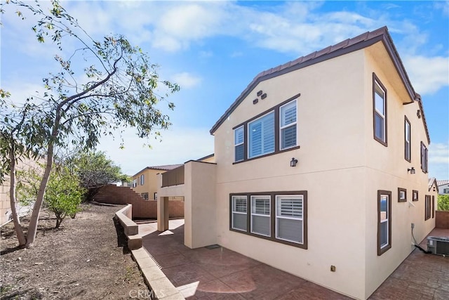15448 Six M Ranch Ln, Fontana, CA 92336 - back of property with a patio area and stucco siding