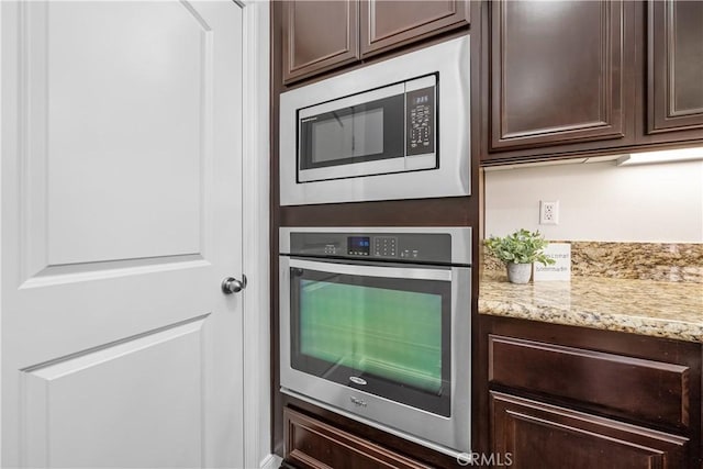 15448 Six M Ranch Ln, Fontana, CA 92336 - kitchen featuring stainless steel appliances, dark brown cabinets, and light stone counters