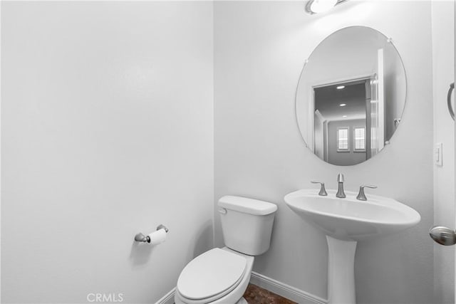 15448 Six M Ranch Ln, Fontana, CA 92336 - bathroom featuring toilet and baseboards