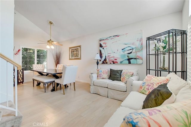 5575 Osborne Ct, San Bernardino, CA 92407 - living room with wood finished floors, a ceiling fan, vaulted ceiling, and stairs