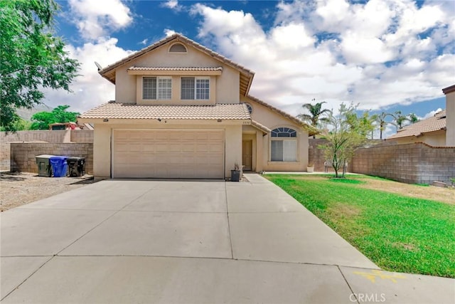 5575 Osborne Ct, San Bernardino, CA 92407 - mediterranean / spanish-style house with stucco siding, a tile roof, concrete driveway, and an attached garage