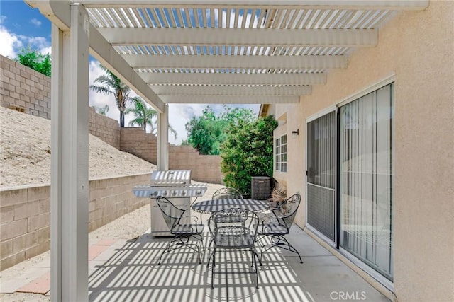 5575 Osborne Ct, San Bernardino, CA 92407 - fenced backyard featuring grilling area, a patio, a pergola, and outdoor dining area