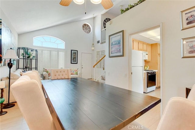 5575 Osborne Ct, San Bernardino, CA 92407 - dining space featuring stairs, a ceiling fan, and high vaulted ceiling